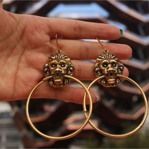 Gold Lion door knocker hoop earrings. Antique vibe